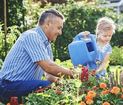 Happy Homeowner In Garden